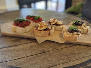 Crostini Selection - Caramelised Onion Haloumi Quince Paste - Roast Sumac Tomato and Feta - Cannellini Beans with Olive and Mint